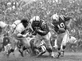 Baltimore Colts QB Johnny Unitas, seen here evading the NY Giants in 1959, is one of the greatest QBs in the history of the NFL. (Image: Neil Leifer/AP)