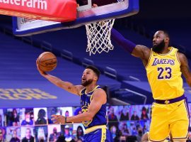 Steph Curry of the Golden State Warriors attempt a layup against LeBron James of the LA Lakers earlier this season at the Chase Center in San Francisco. (Image: Noah Graham/Getty)